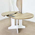 Table à manger ronde élégante de style ferme avec rallonge et piètement en X, idéale pour une salle à manger moderne