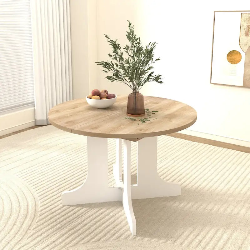 Table à manger ronde élégante de style ferme avec rallonge et piètement en X, idéale pour une salle à manger moderne